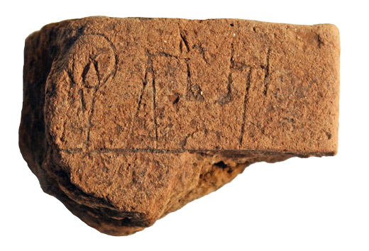 A 2-inch by 3-inch tablet was discovered in Iklaina, Greece. It’s the oldest known tablet in Europe. The back of the tablet is pictured. Photo by Christian Mundigler, courtesy of the University of Missouri–St. Louis