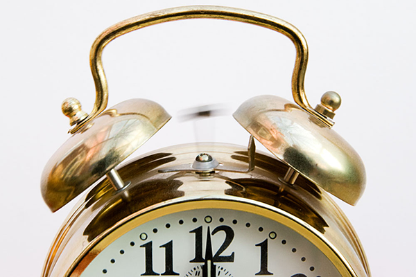 top half of golden alarm clock