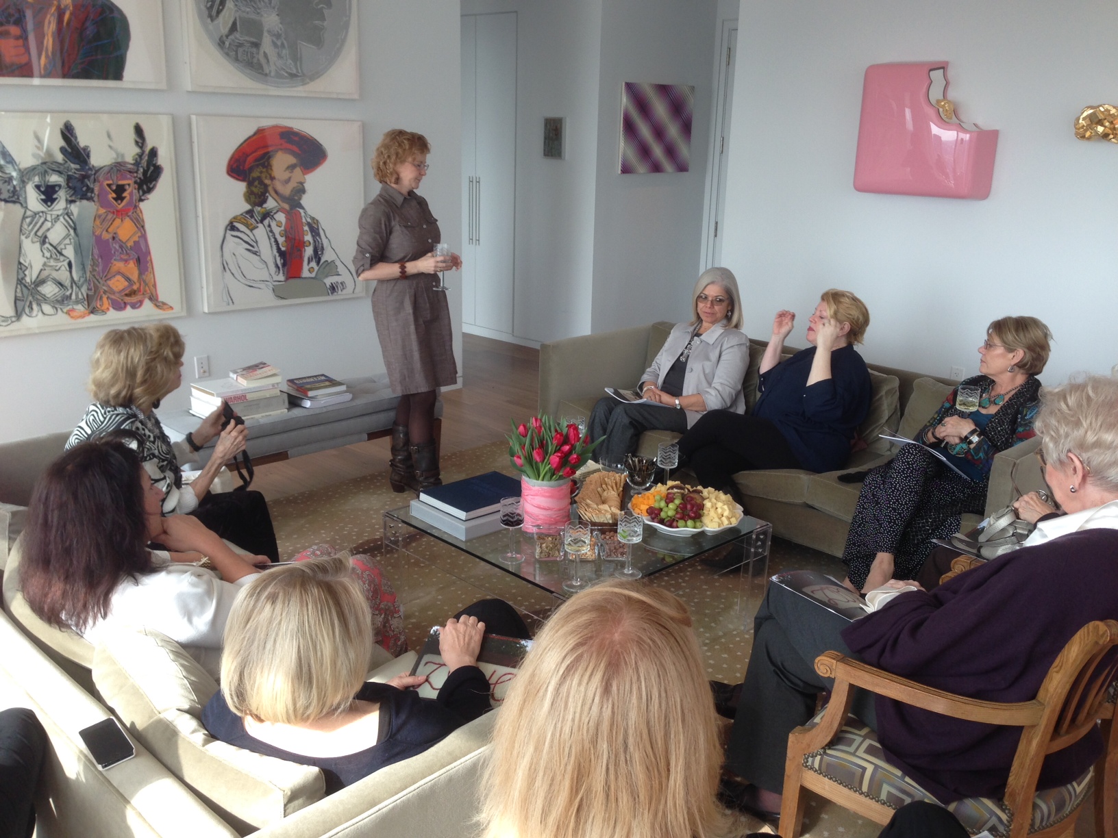 talking to group in living room