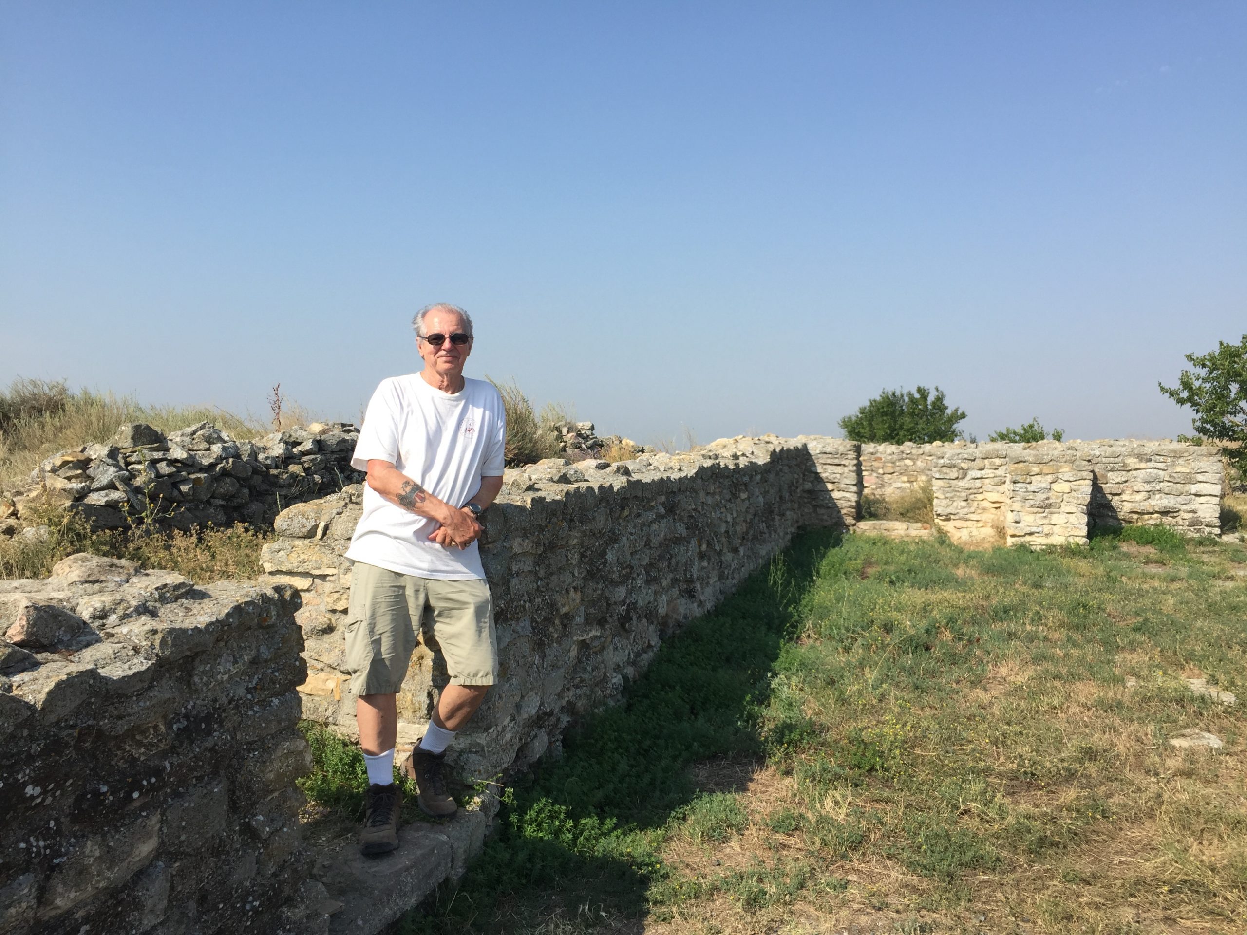 Orr stands amongst Histria ruins in Romania.