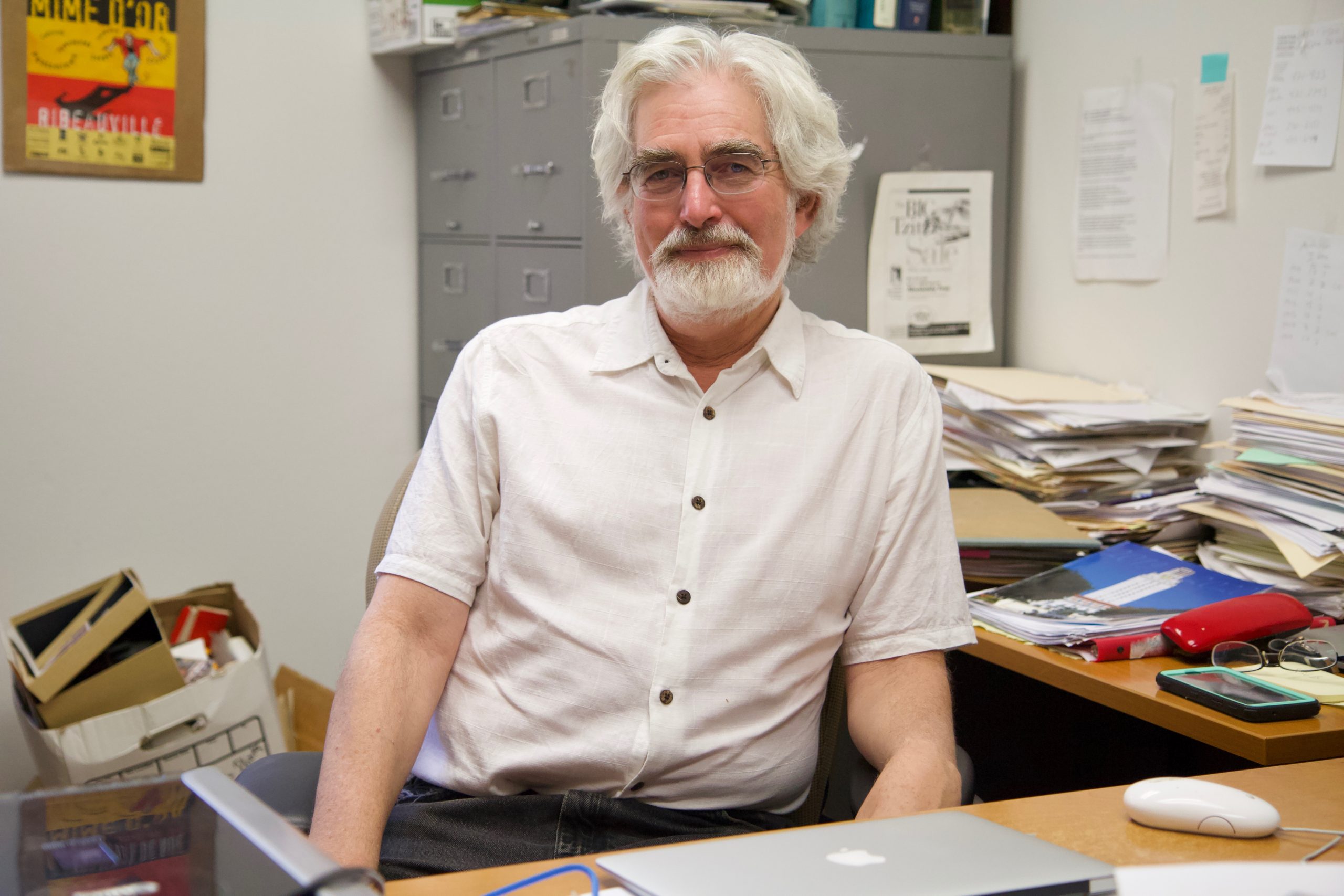 Itzik Gottesman sitting at desk.