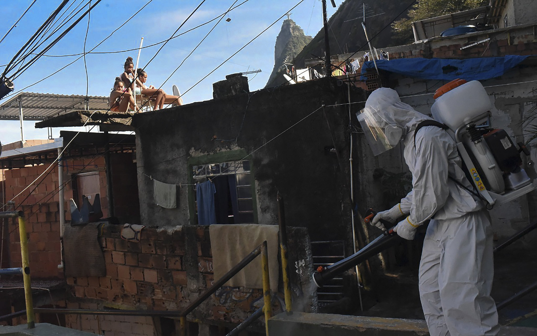man disinfects street in Rio de Janeiro Brazil